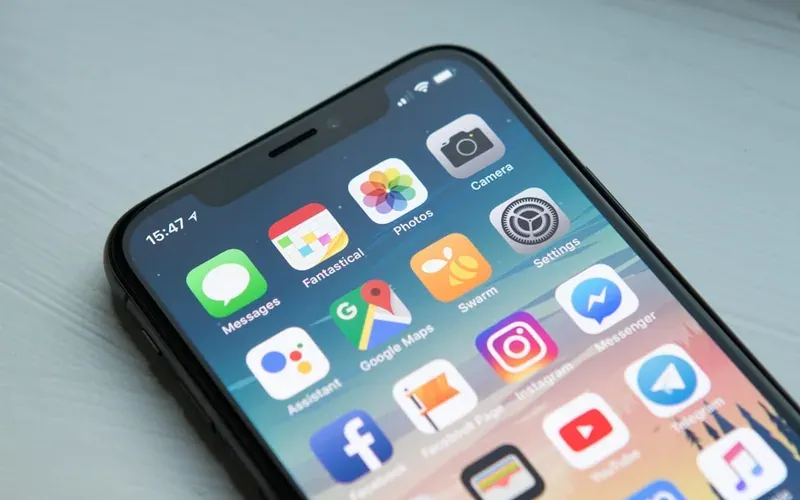 Smartphone with travel insurance app open for planning a Japan trip