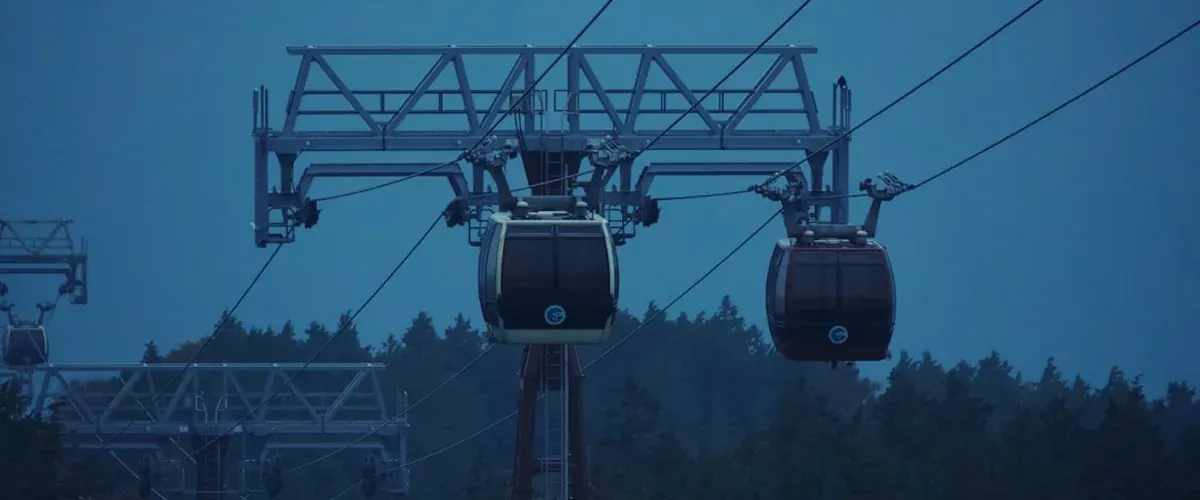 Hakone ropeway cable car with Owakudani volcanic valley and steam in the background