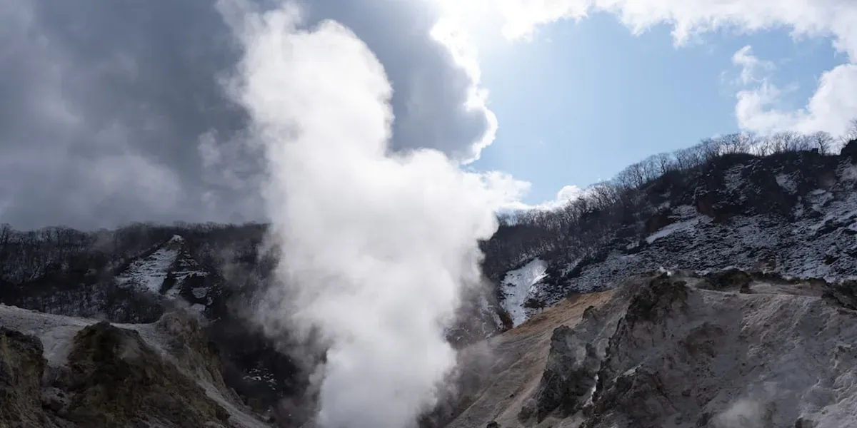 Owakudani volcanic valley in Hakone Japan with sulphurous steam vents and yellow rock formations