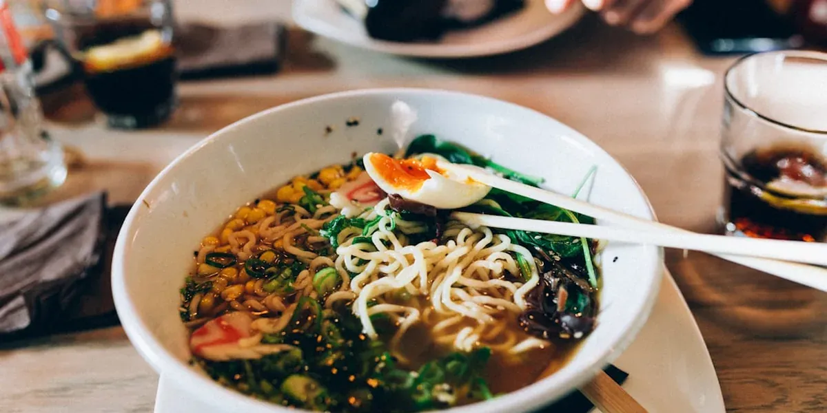 A Tokyo restaurant bowl with fresh vegetables, plant-based, served in a casual setting