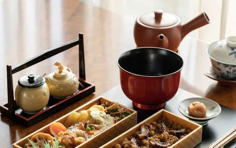 Hot food counter at a Japanese FamilyMart showing fried chicken and steamed buns