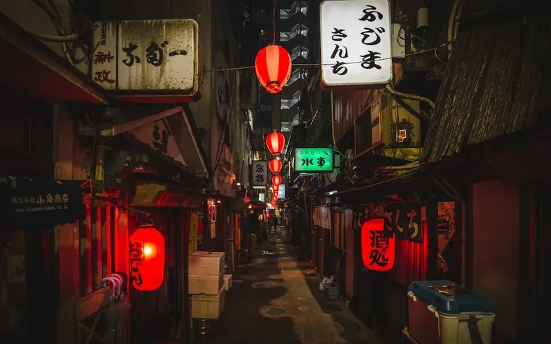 Traditional Japanese shrine lanterns glowing at night in Fukuoka