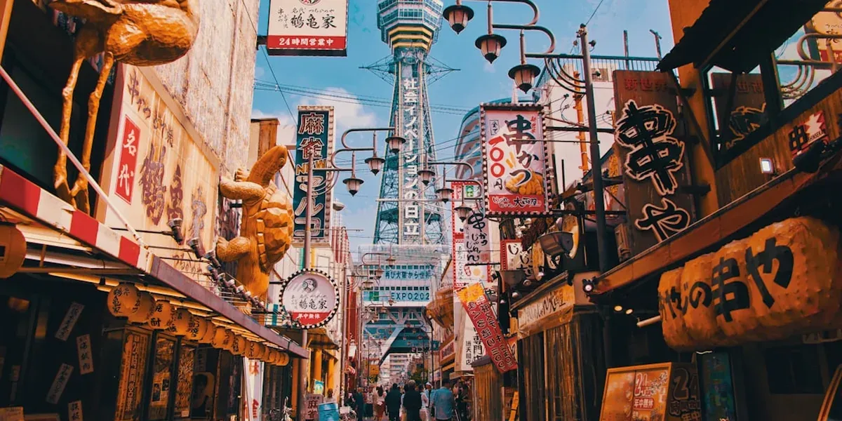 The retro Shinsekai neighborhood in Osaka with vintage shop fronts and Tsutenkaku Tower