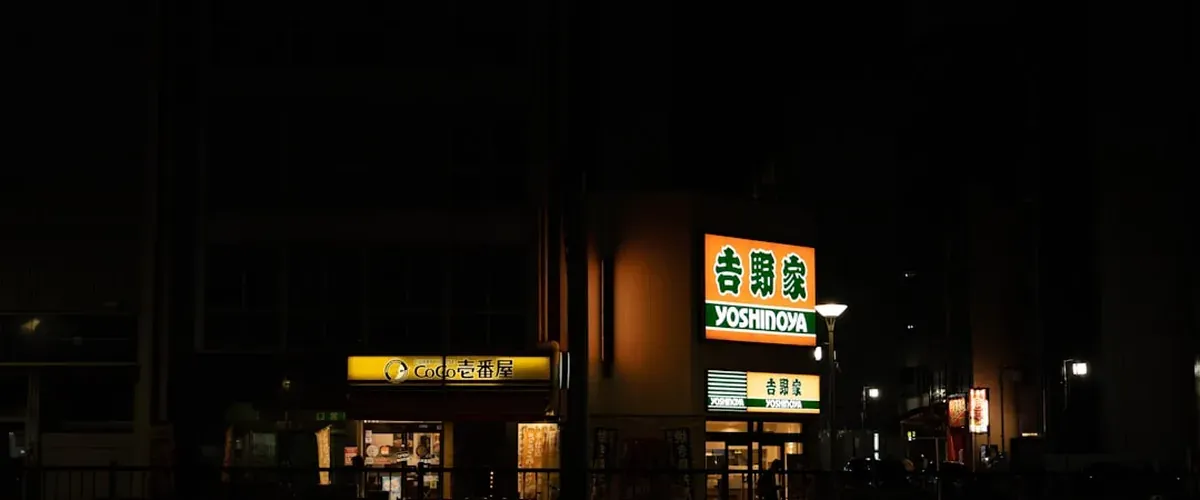 Japanese highway bus at night parked at a terminal for long distance budget travel