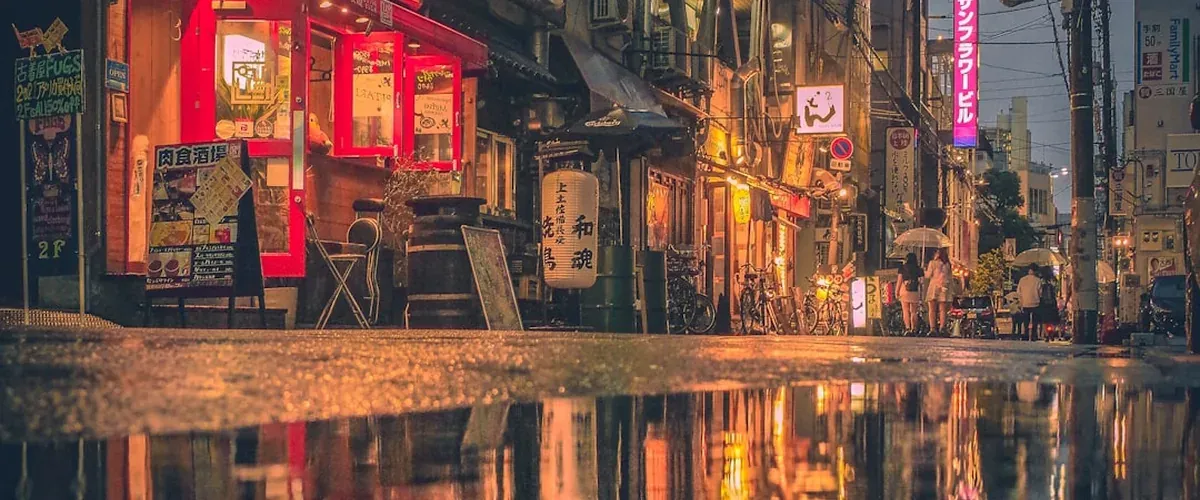 Hiroshima riverside at evening with city lights reflecting on the calm water