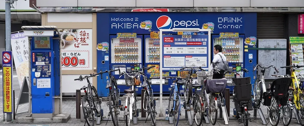 IC card being tapped for contactless payment at a Japanese convenience store register