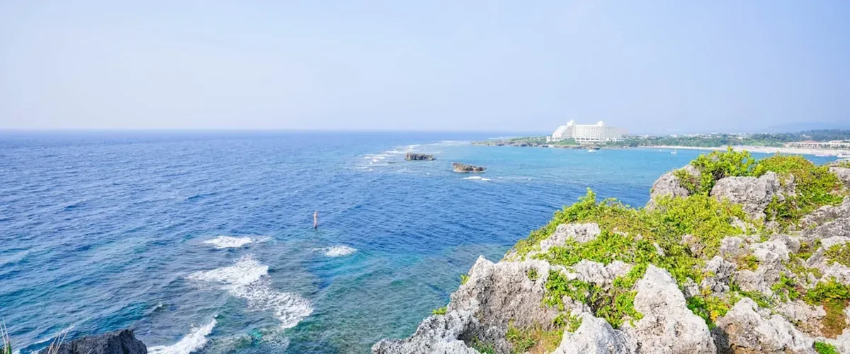 Cape Manzamo in northern Okinawa with dramatic coastal cliff, elephant-trunk shaped rock formation, and turquoise water below