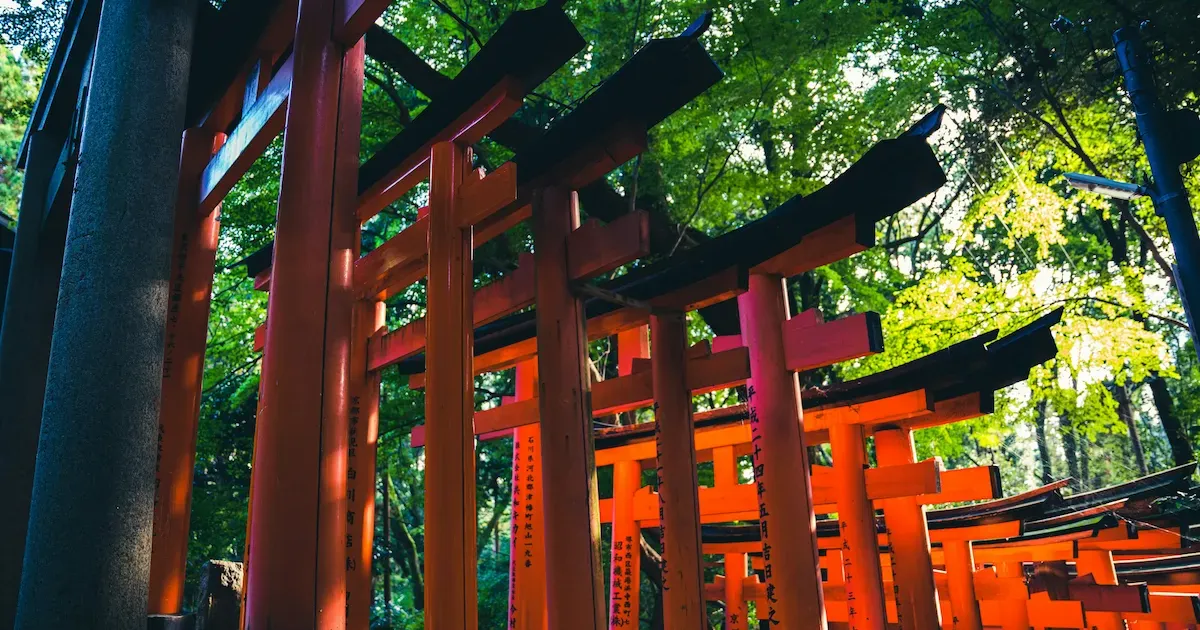 Fushimi Inari torii gates at sunrise with no crowds in Kyoto Japan